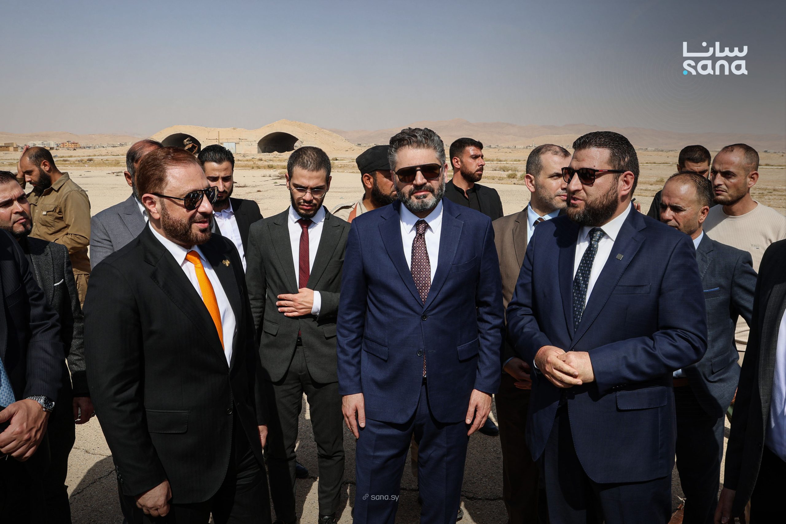 The government delegation on the apron at Palmyra Airport during the rehabilitation requirements assessment tour — Photo: SANA
