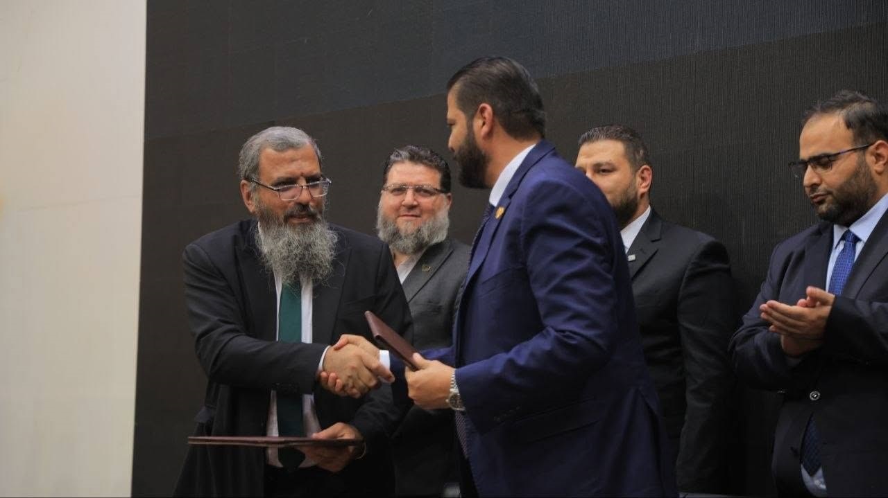 Handshake after signing the two MoUs in Hasyiah