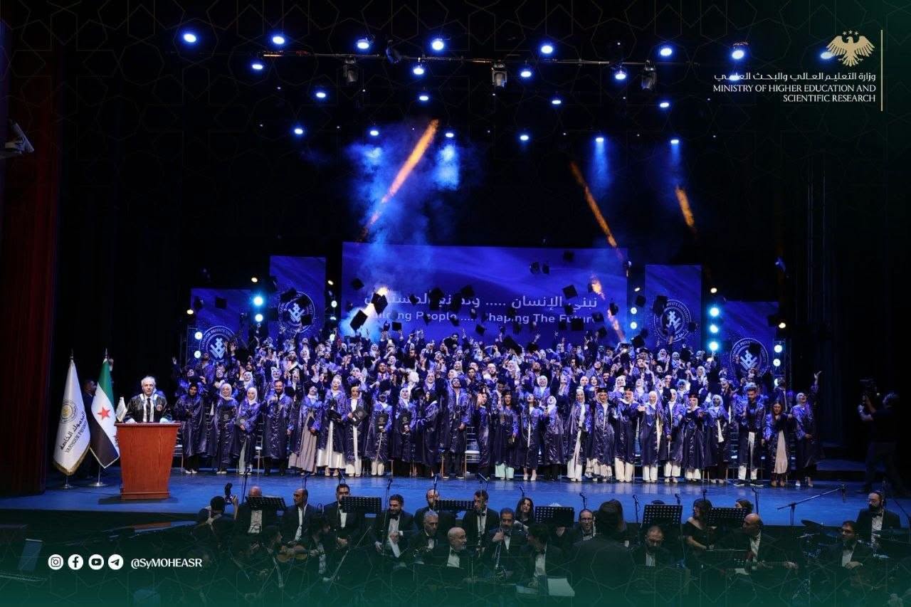 Group photo of the 'Future Syria' graduates on the Damascus Opera House stage